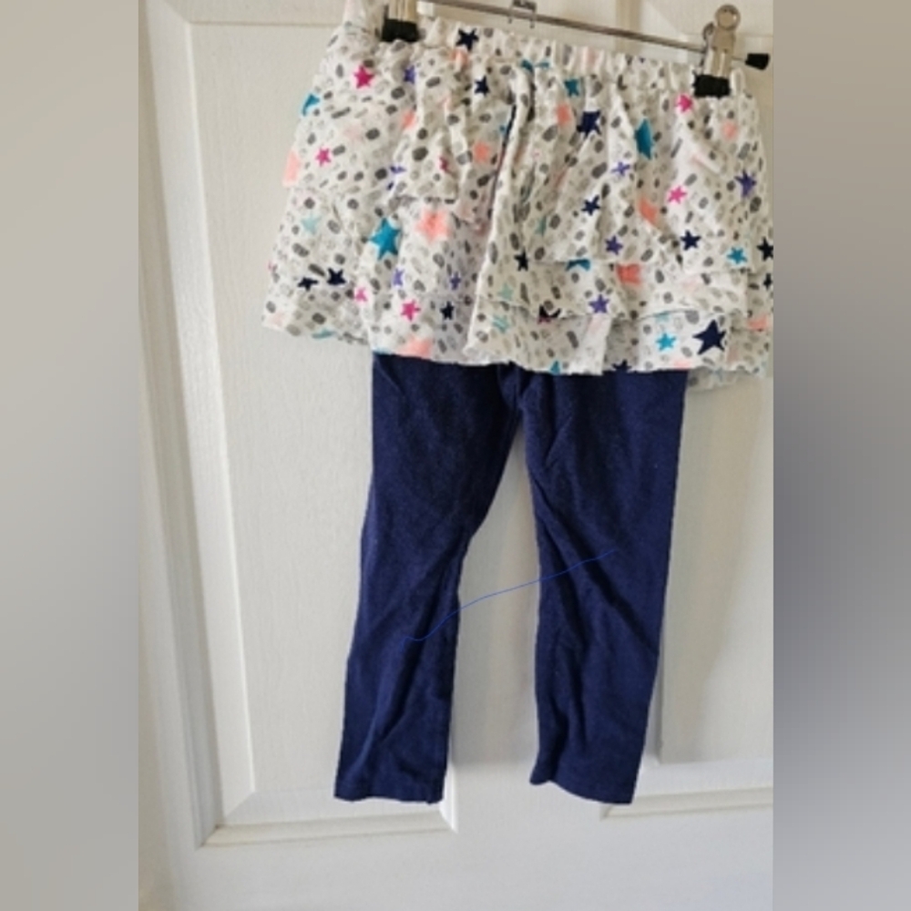 Cat & Jack blue leggings underneath and the top is a skirt that has stars & more